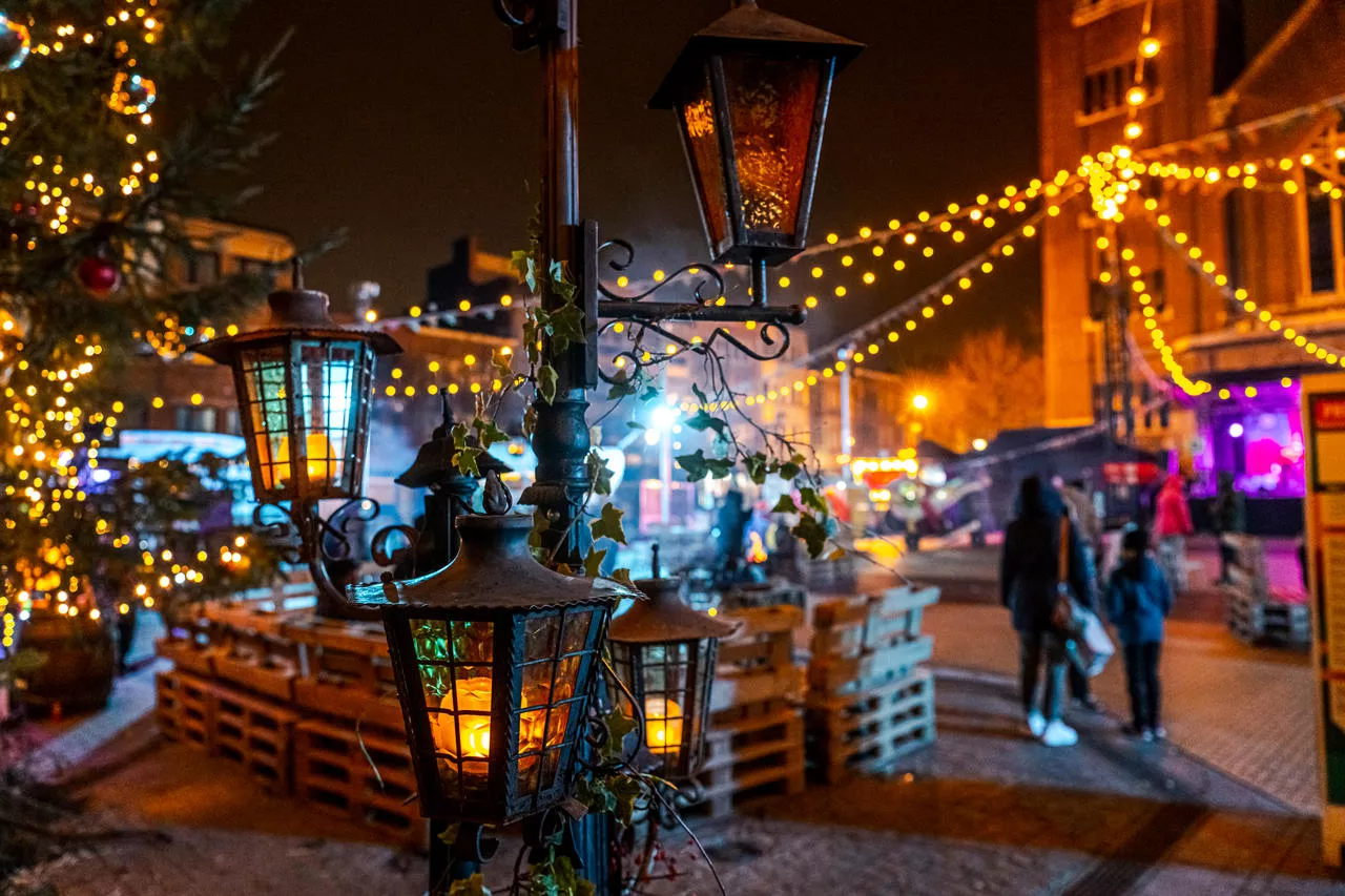 Christmas market with charming lights and crafts chalets